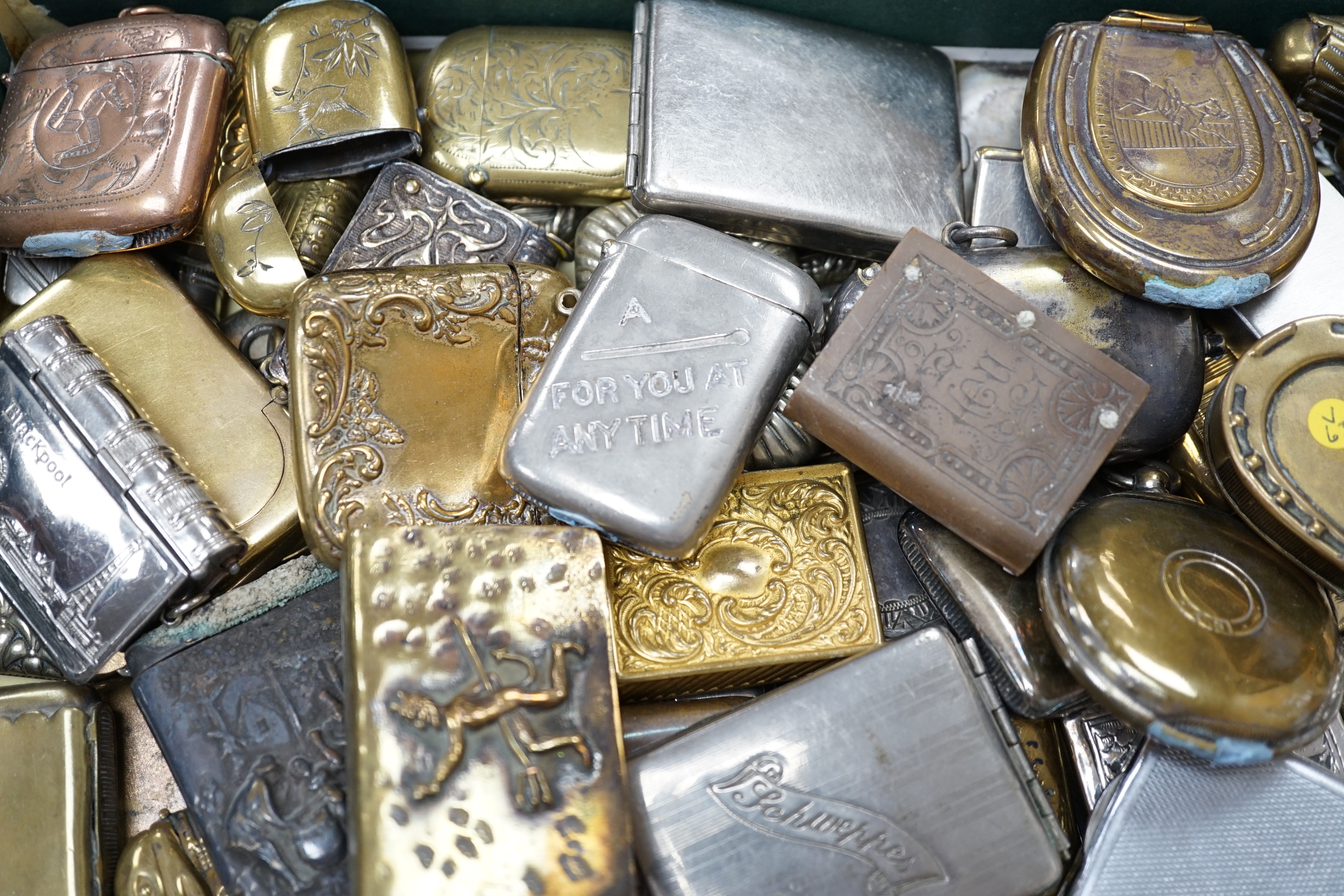 A large collection of mixed metal vestas including brass and copper